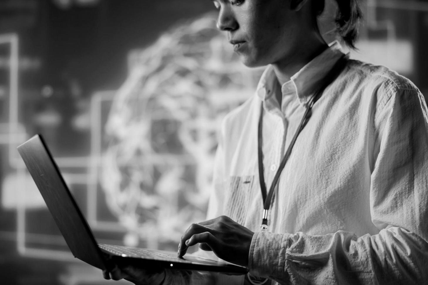 Students collaborating on mobile game development projects in modern learning environment