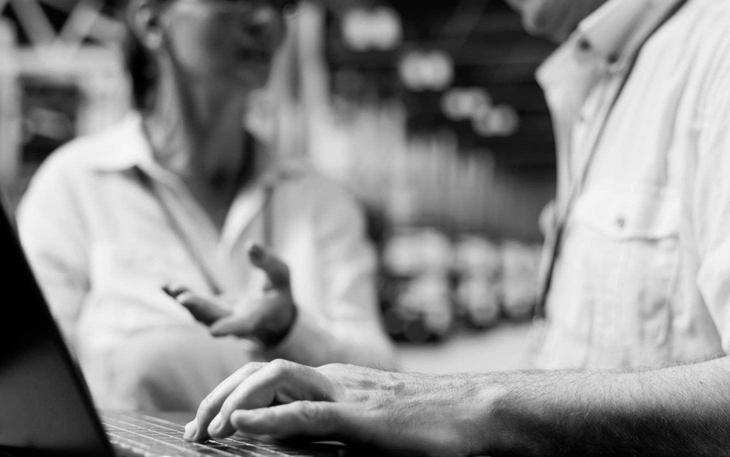 Game development team reviewing code architecture and testing mobile game performance